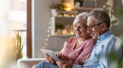 Image of elderly couple looking at home remodeling plans.
